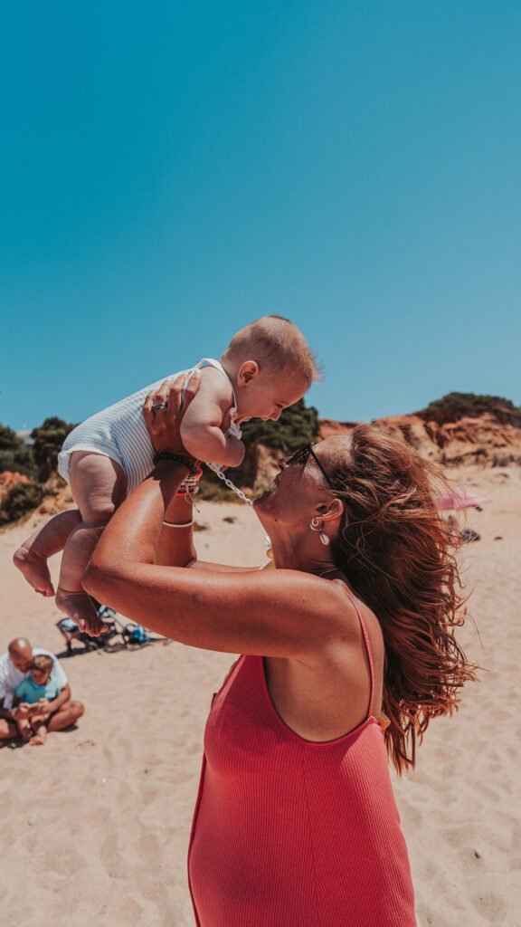 Travelling with a baby while parent holding on a family holiday