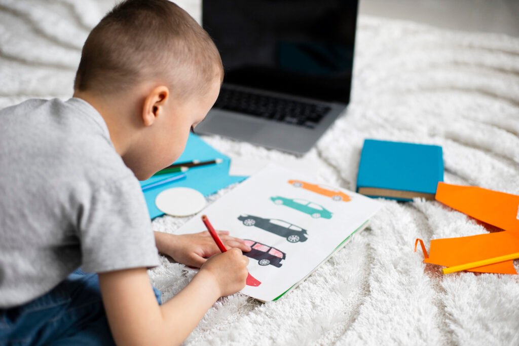 Child colouring as a calm screen-free activity before bedtime